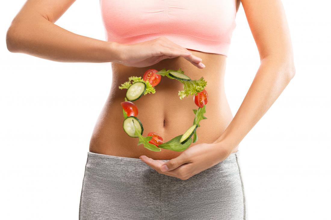 woman-with-vegetables-hovering-in-front-of-her-belly.jpg