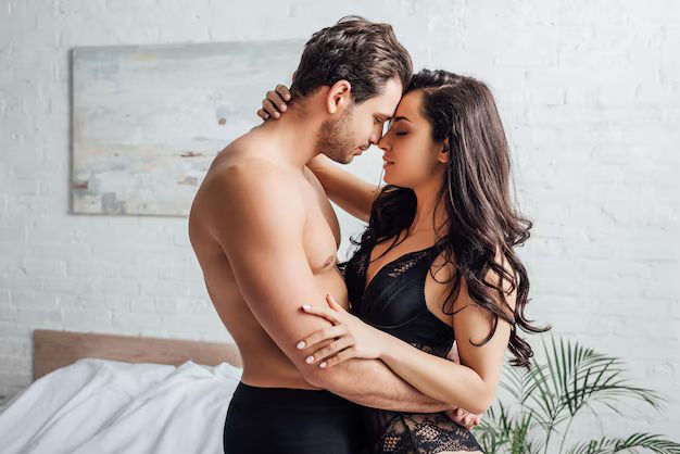 handsome-man-hugging-with-sexy-woman-bedroom_656932-201.jpg