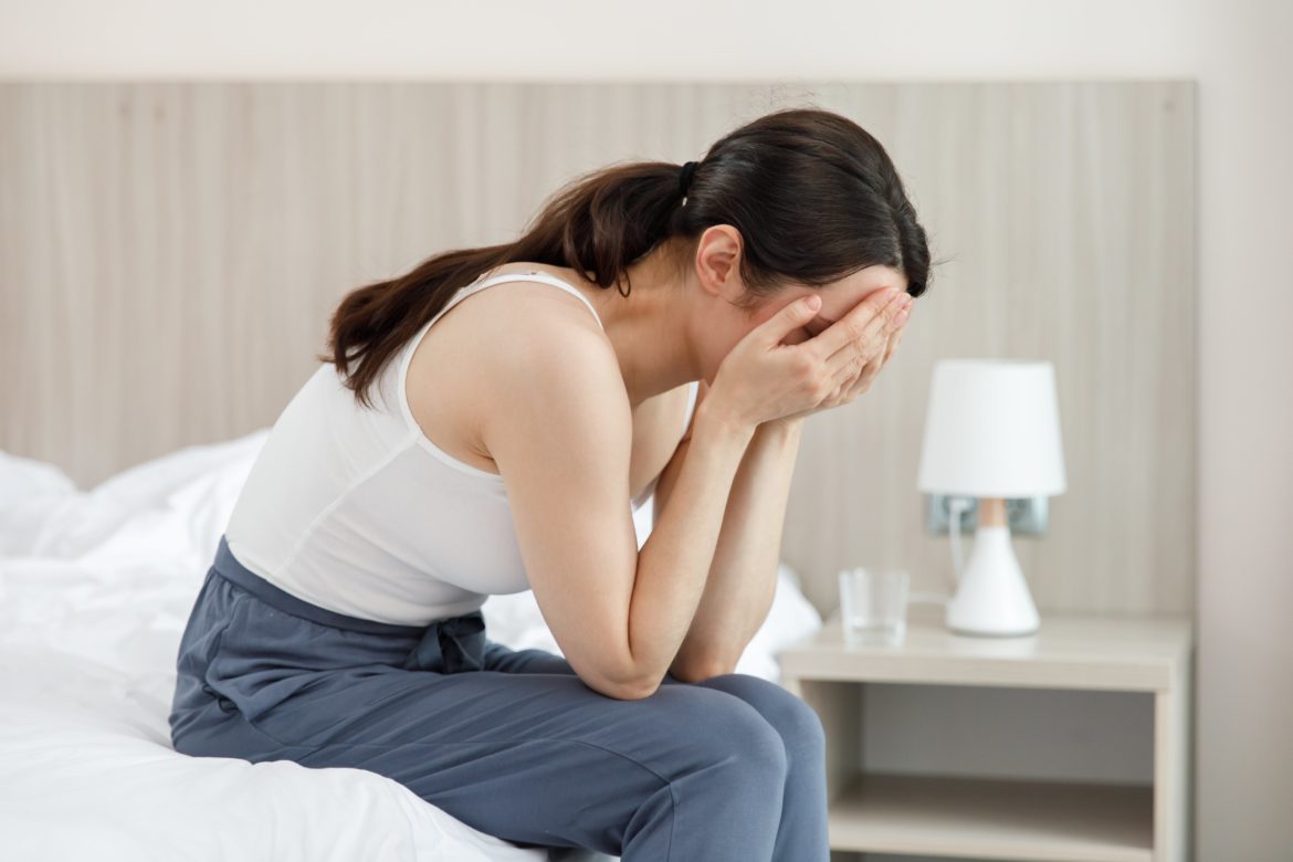 woman-sits-in-the-bedroom-and-cries-covering-her-face-with-her-hands-min-1170x780.jpg